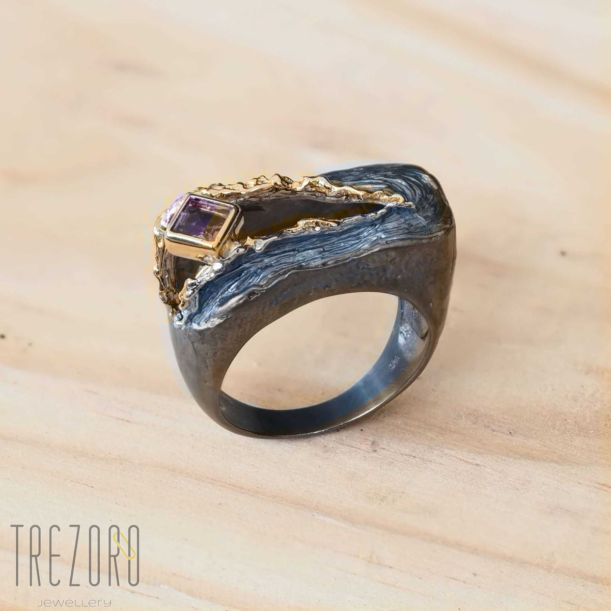 NEW amazing Surprise Ring. Oxidised and Gold Plated Sterling Silver wih natural Amethyst. On wood.